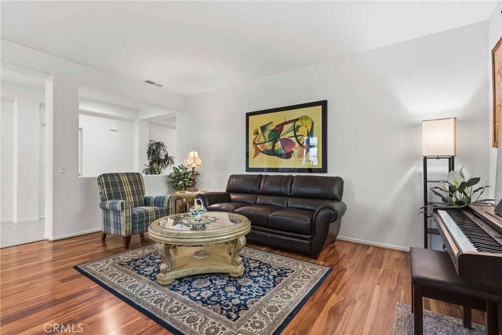 33145 Vermont Road Temecula, CA 92592 - Photo 5 of 41 a living room with furniture and a rug