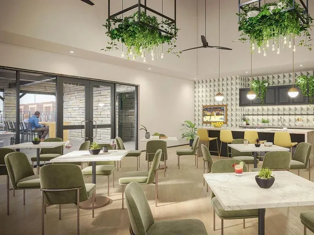 a view of a swimming pool and lounge chairs