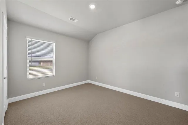 a bathroom with a toilet a sink a mirror a bathtub and shower