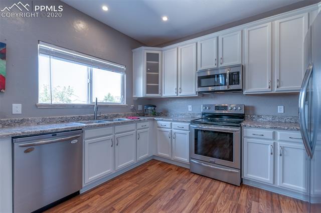 7868 Coffee Road Peyton, CO 80831 - Photo 14 of 27 Large kitchen window facing the beautiful western sky