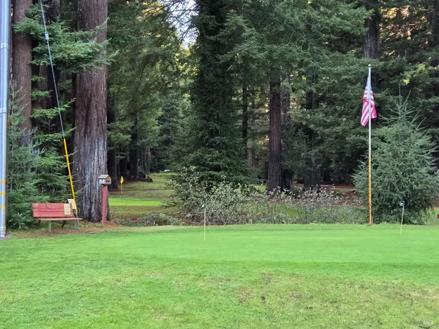 an outdoor space with furniture and garden