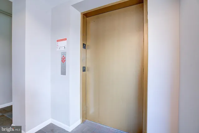 a view of a hallway with dining area