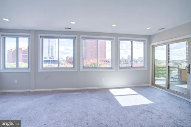 a kitchen with cabinets stainless steel appliances and a sink