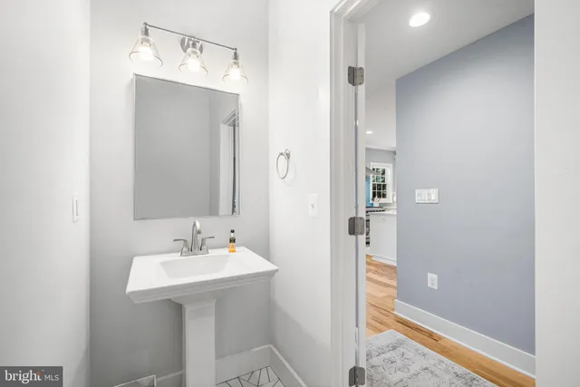 a bathroom with a sink and mirror