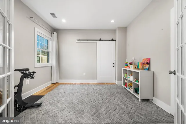 a view of a storage & utility room with closet window