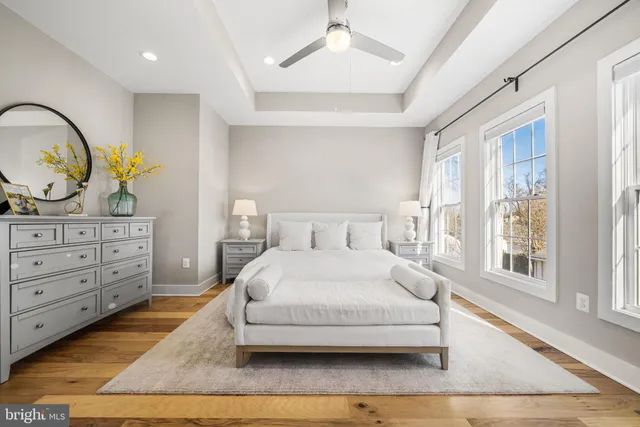 a bedroom with a large bed and a flat screen tv