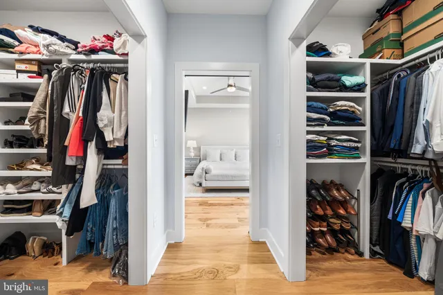 a kitchen with a sink a stove a dining table and chairs