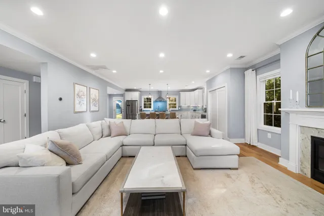 a living room with furniture white walls and white walls