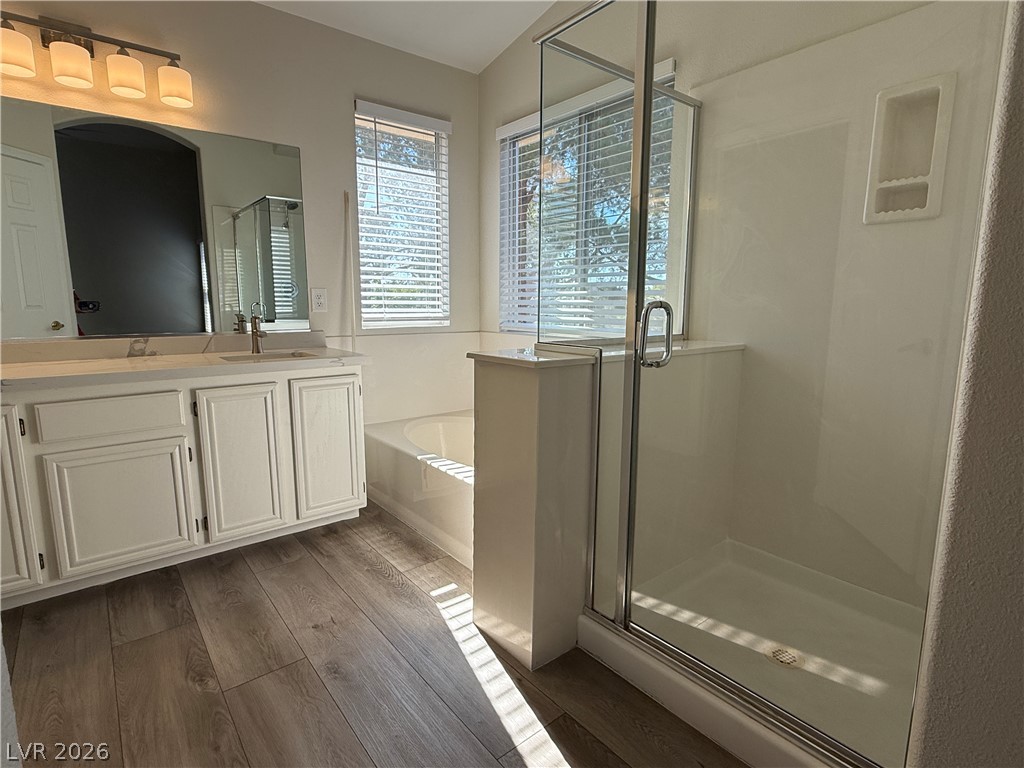 1908 Thunder Ridge Circle Henderson, NV 89012 - Photo 12 of 28 A well-appointed bathroom offers both a deep soaking tub and a separate glass-enclosed shower.