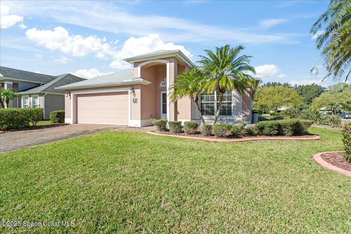 1366 Blazen Ridge Court Melbourne, FL 32934 - Photo 1 of 23 a front view of a house with garden