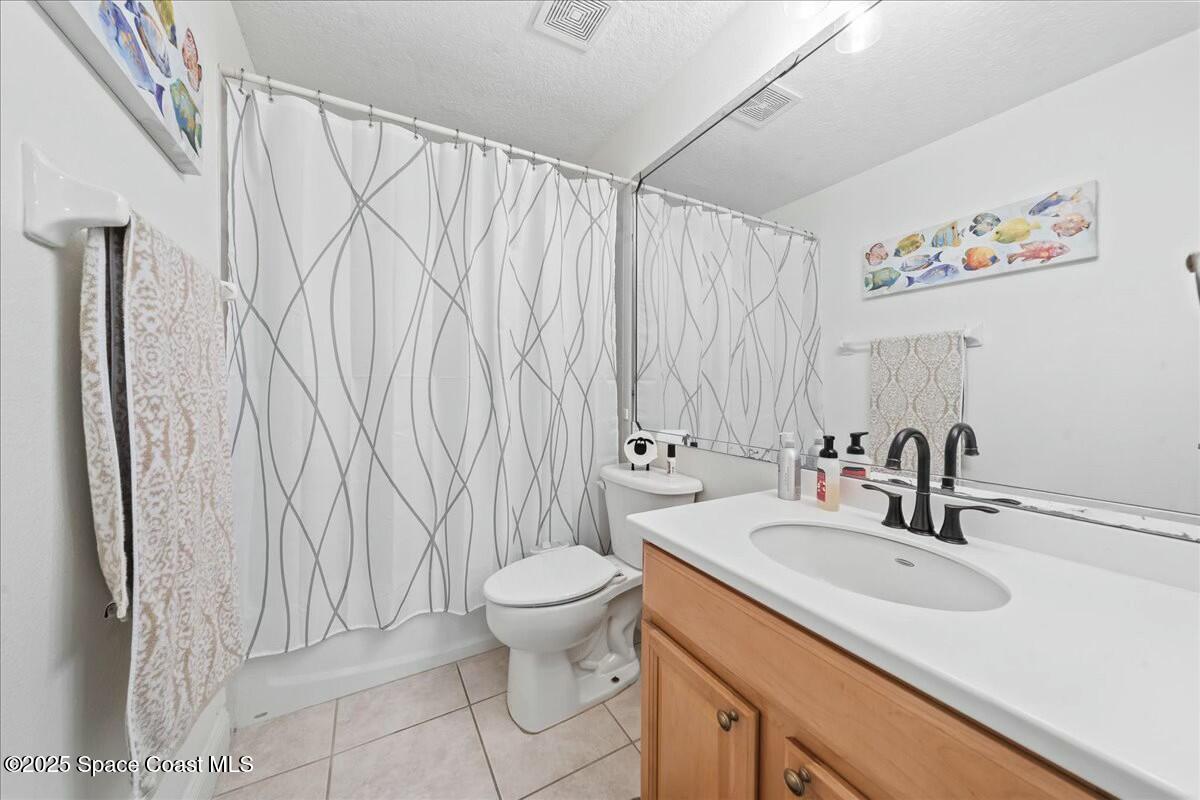 1366 Blazen Ridge Court Melbourne, FL 32934 - Photo 17 of 23 a bathroom with a sink toilet and shower