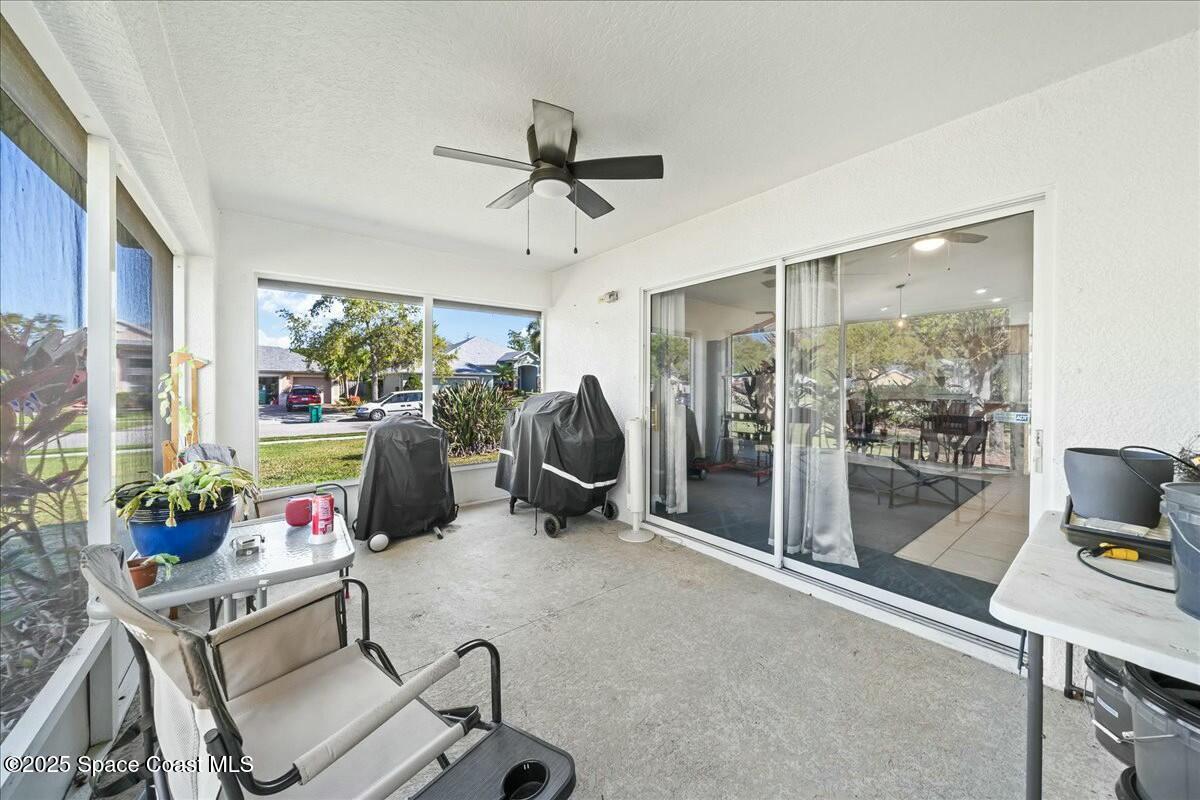 1366 Blazen Ridge Court Melbourne, FL 32934 - Photo 21 of 23 a room with gym equipment and a large window