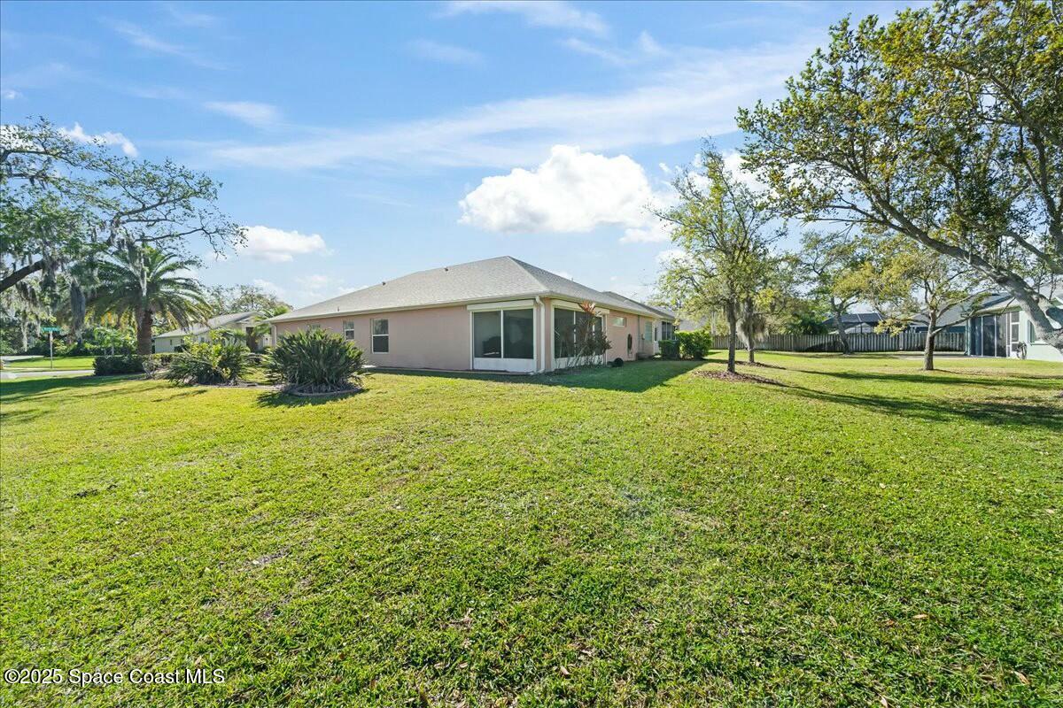 1366 Blazen Ridge Court Melbourne, FL 32934 - Photo 22 of 23 a view of a house with a yard