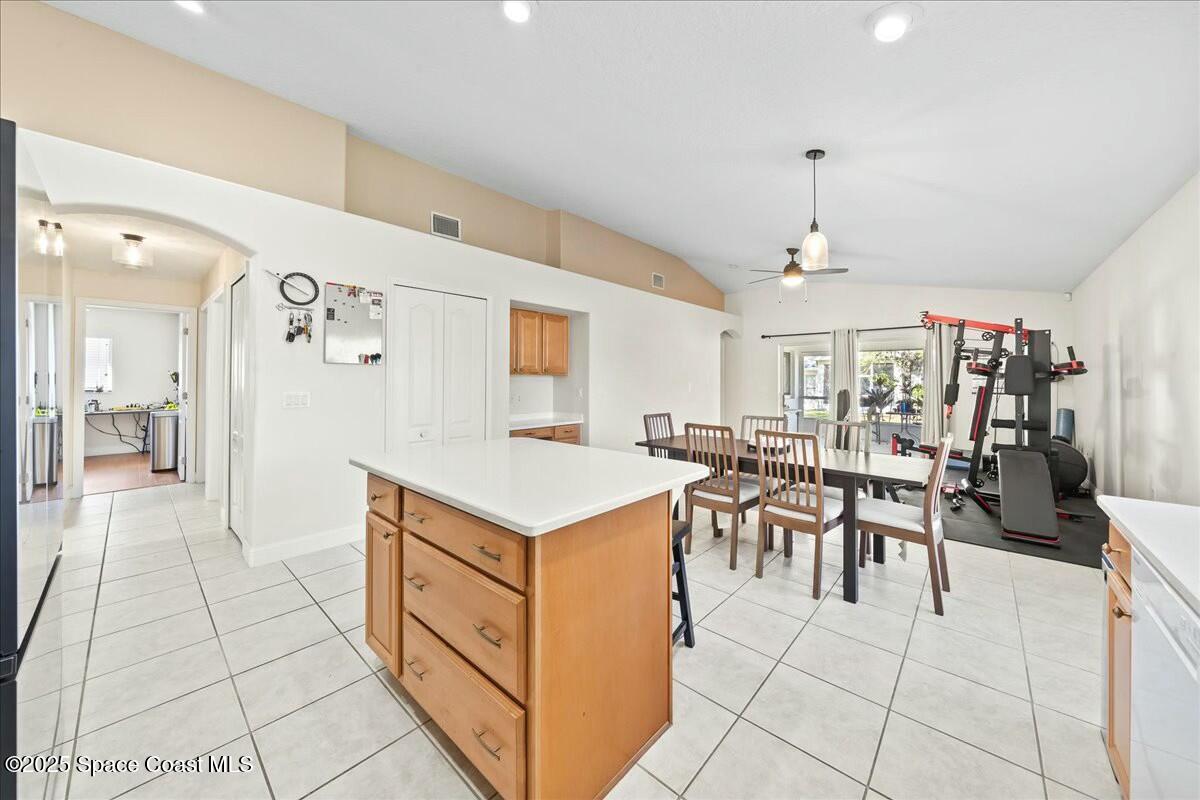 1366 Blazen Ridge Court Melbourne, FL 32934 - Photo 7 of 23 a view of a kitchen and dining room