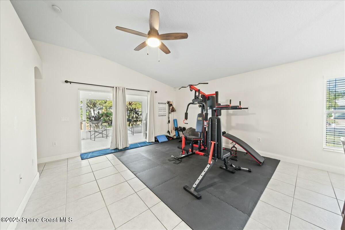 1366 Blazen Ridge Court Melbourne, FL 32934 - Photo 9 of 23 a view of a room with gym equipment