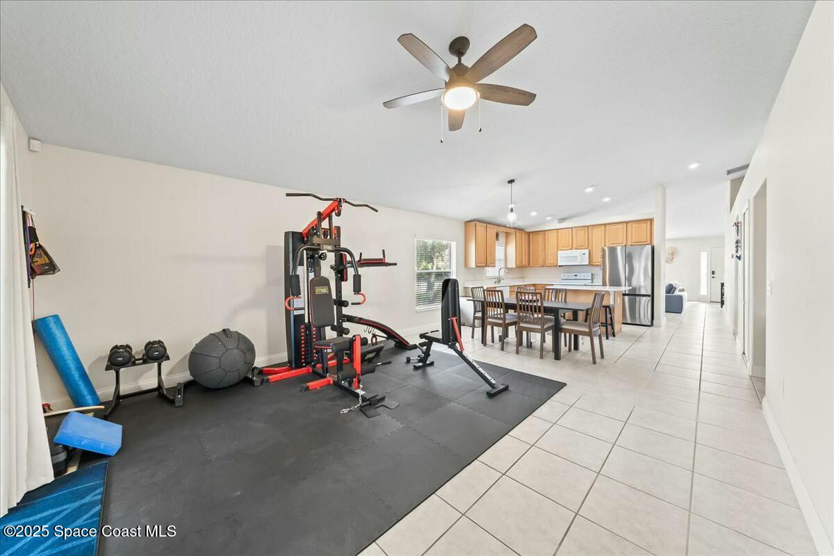 1366 Blazen Ridge Court Melbourne, FL 32934 - Photo 10 of 23 a view of a room with gym equipment