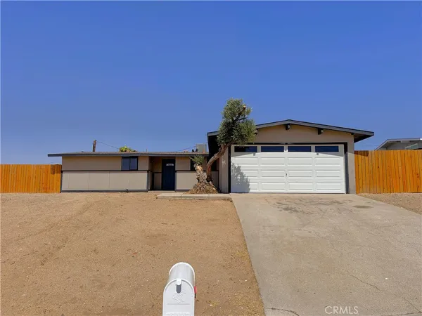 a front view of a house with a garage