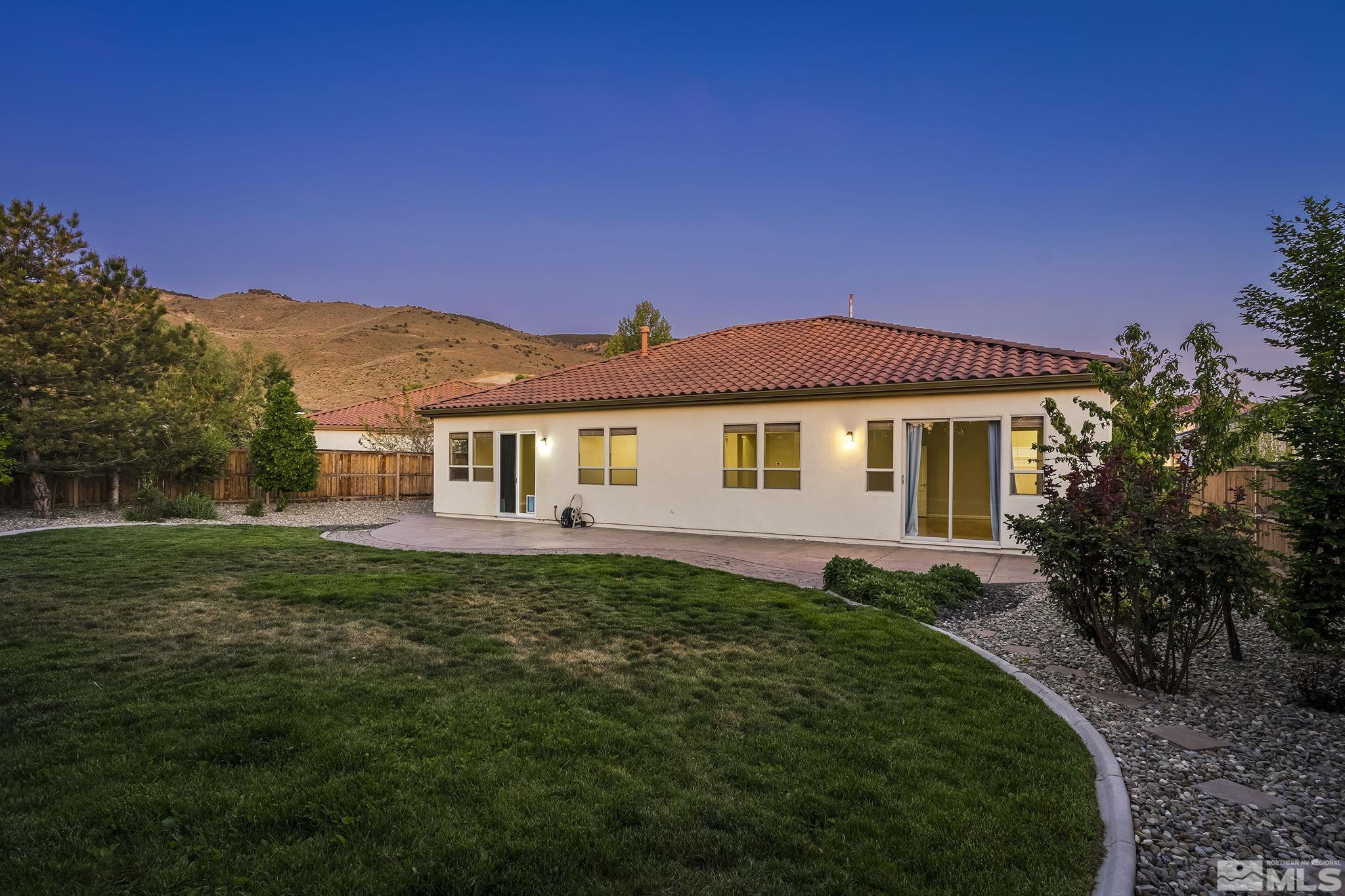 2685 Alder Bridge Court Reno, NV 89521 - Photo 28 of 38 a front view of a house with a yard