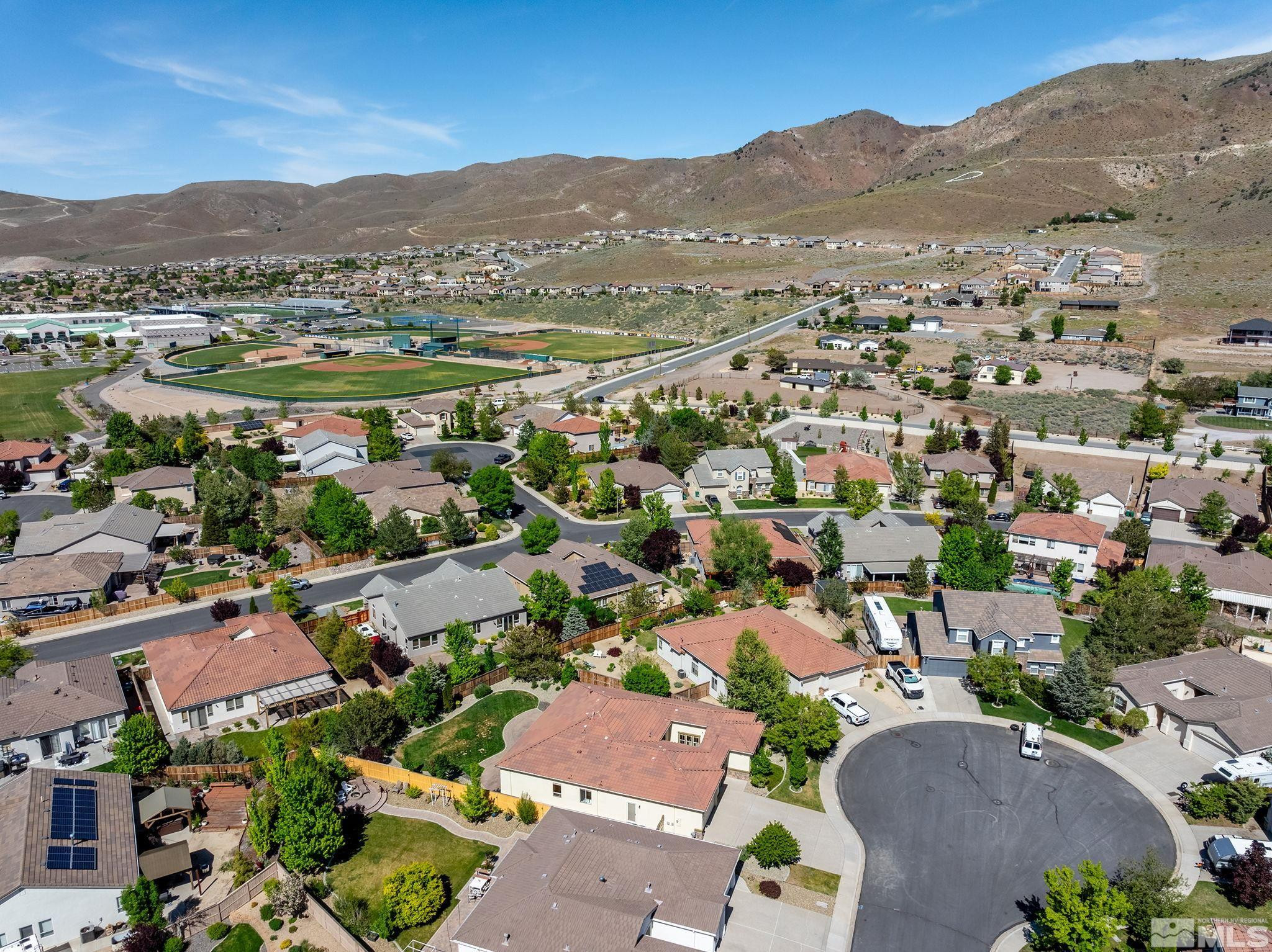 2685 Alder Bridge Court Reno, NV 89521 - Photo 34 of 38 an aerial view of residential houses with outdoor space
