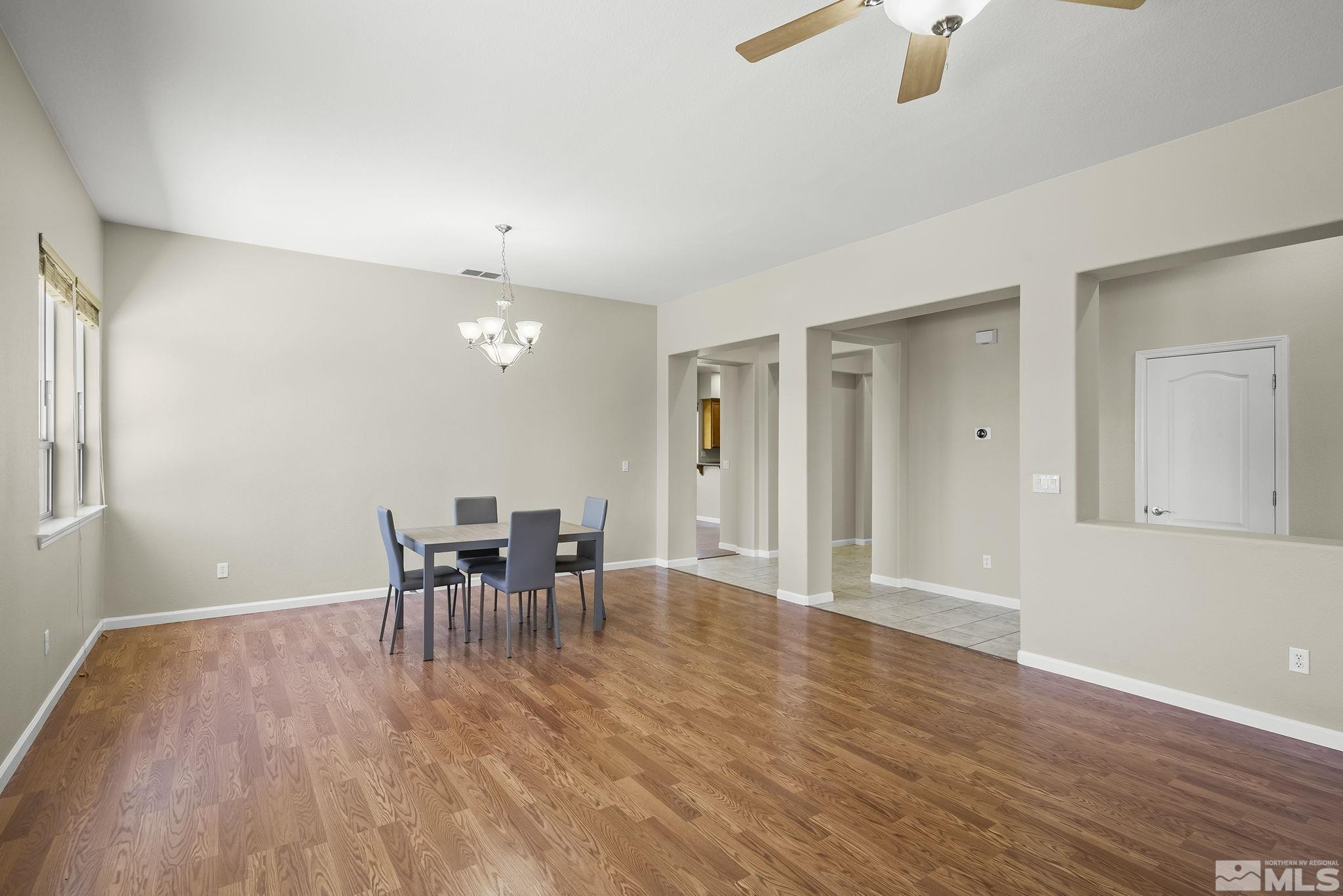 2685 Alder Bridge Court Reno, NV 89521 - Photo 5 of 38 a view of a dining room with furniture and wooden floor