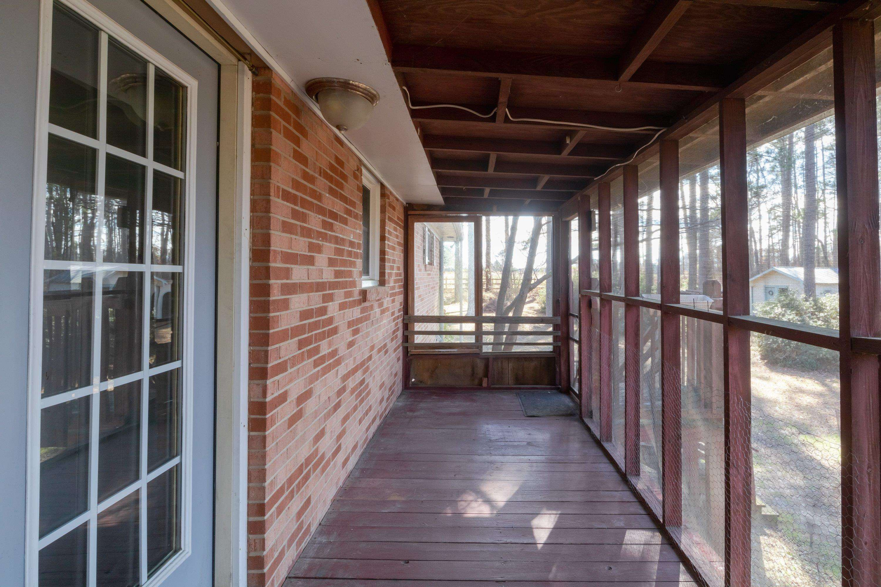 4612 Browns Pond Road Selma, NC 27576 - Photo 38 of 50 Screened porch with entry from living room