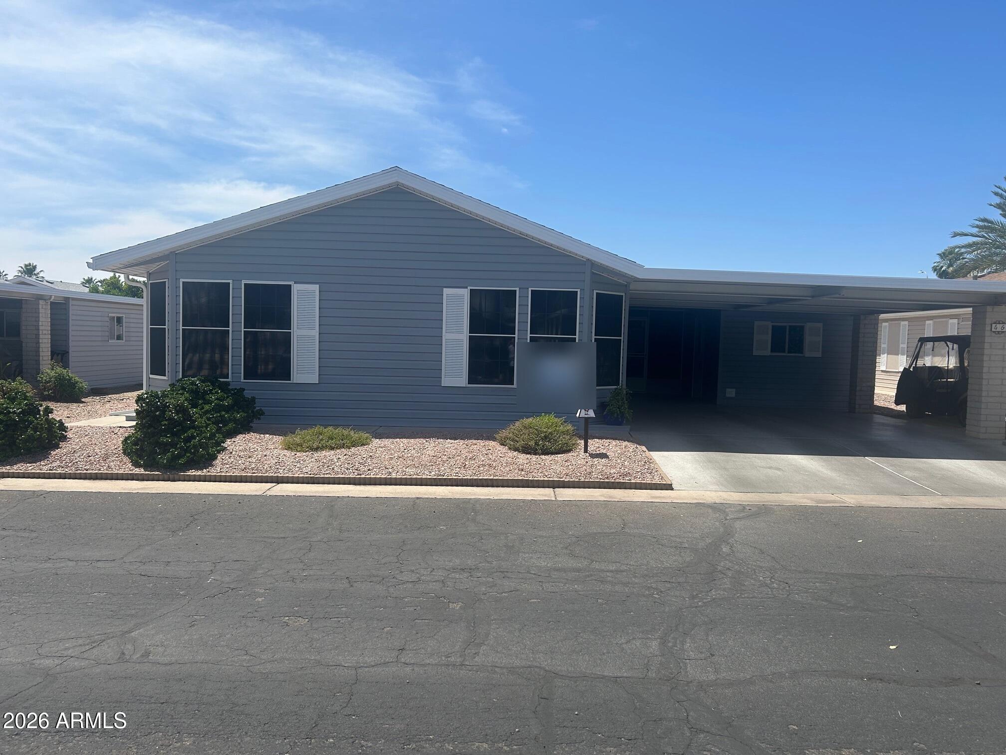 2550 South Ellsworth Road, Unit 46 Mesa, AZ 85209 - Photo 4 of 46 a house view with a outdoor space