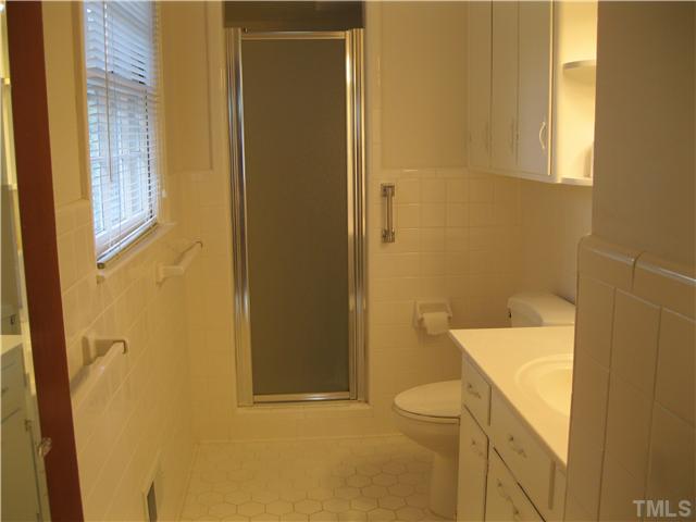 408 Fletcher Drive Raleigh, NC 27603 - Photo 14 of 22 a bathroom with a sink a toilet and shower