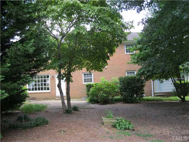 408 Fletcher Drive Raleigh, NC 27603 - Photo 17 of 22 a front view of a house with garden