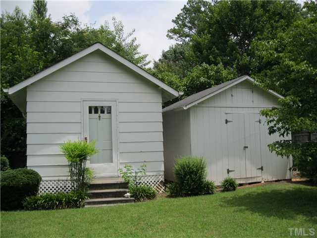 408 Fletcher Drive Raleigh, NC 27603 - Photo 5 of 22 a front view of a house with a garden