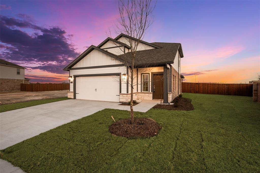 232 Sutter Mill Road Saginaw, TX 76131 - Photo 2 of 24 a front view of a house with a yard and garage