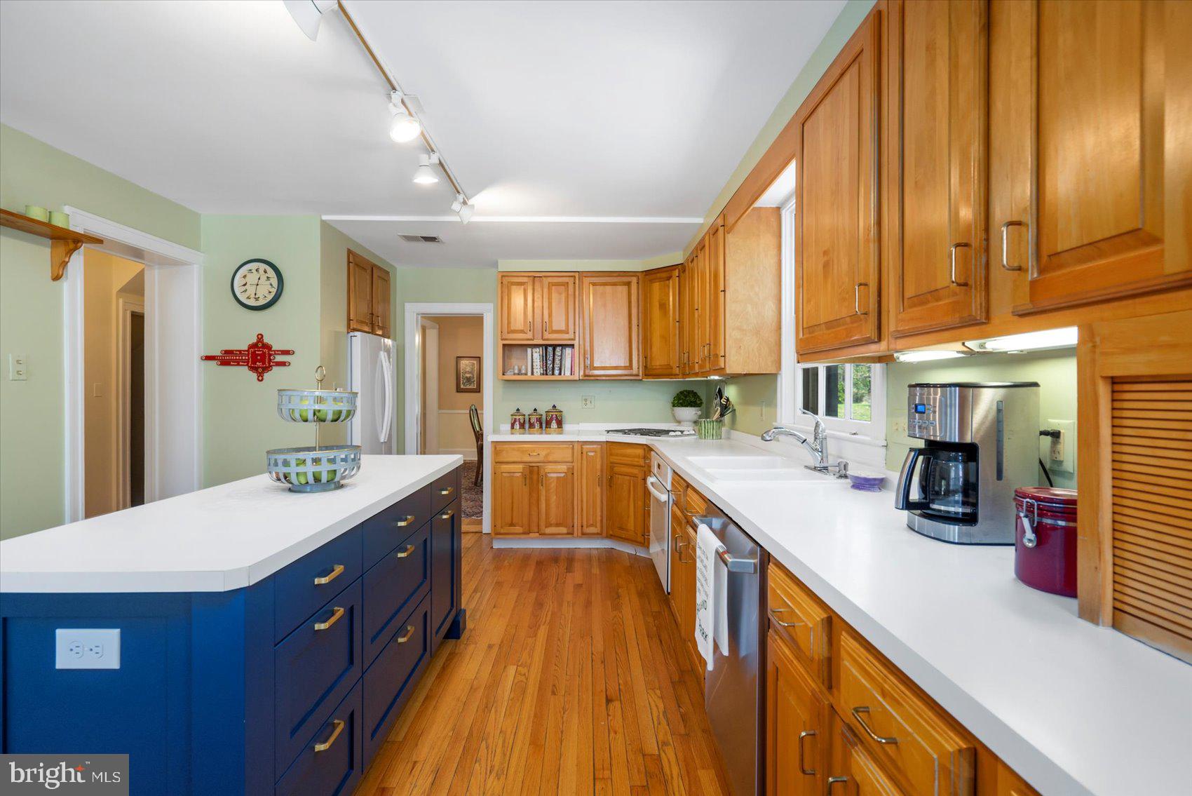 600 Somerset Road Baltimore, MD 21210 - Photo 14 of 59 a kitchen with stainless steel appliances a sink stove and cabinets