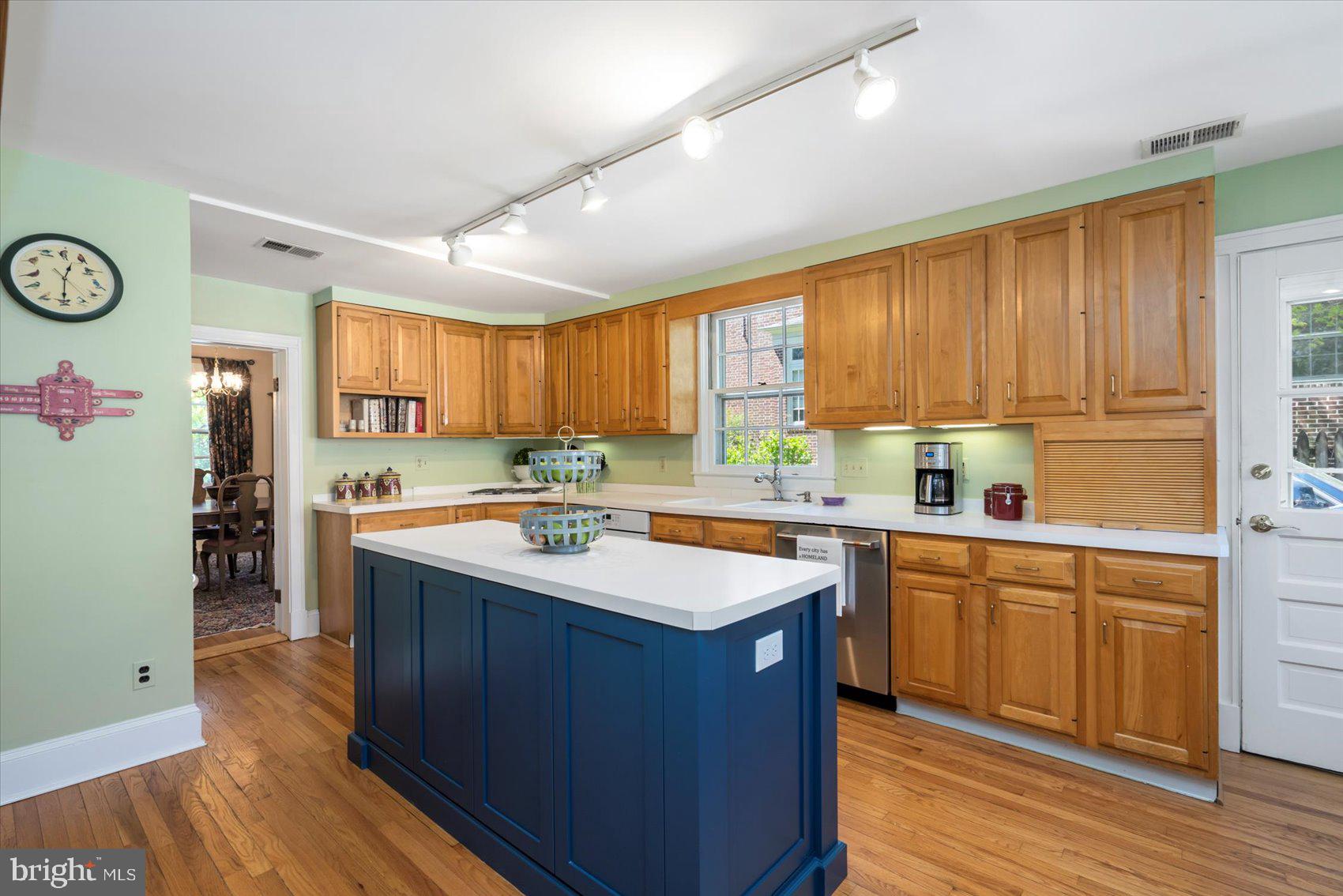 600 Somerset Road Baltimore, MD 21210 - Photo 17 of 59 a kitchen with wooden cabinets sink and stove