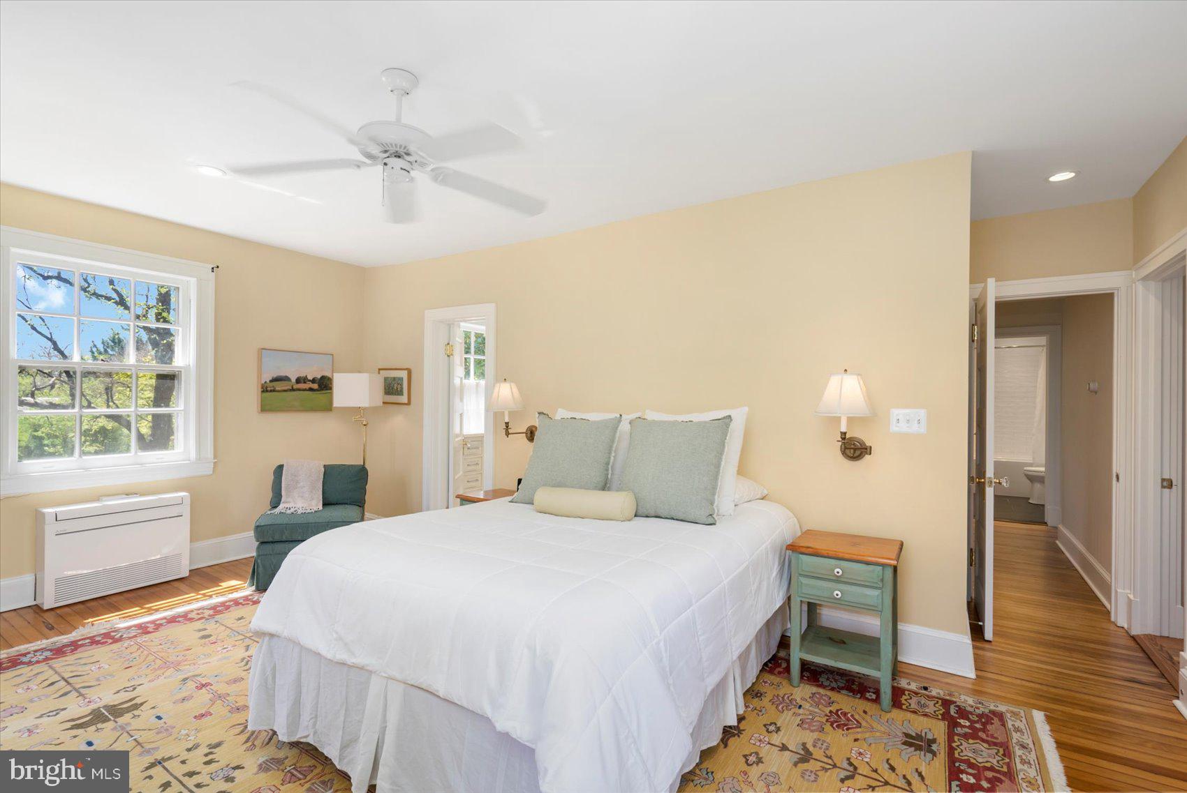 600 Somerset Road Baltimore, MD 21210 - Photo 28 of 59 a bedroom with a bed and wooden floor