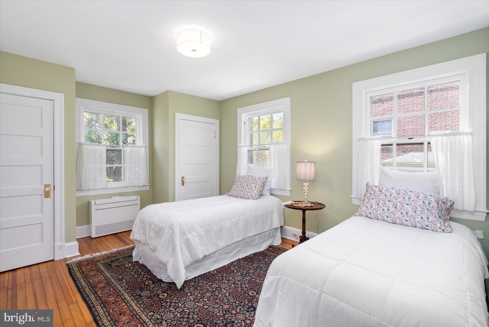 600 Somerset Road Baltimore, MD 21210 - Photo 35 of 59 a bedroom with two beds and painting on the wall