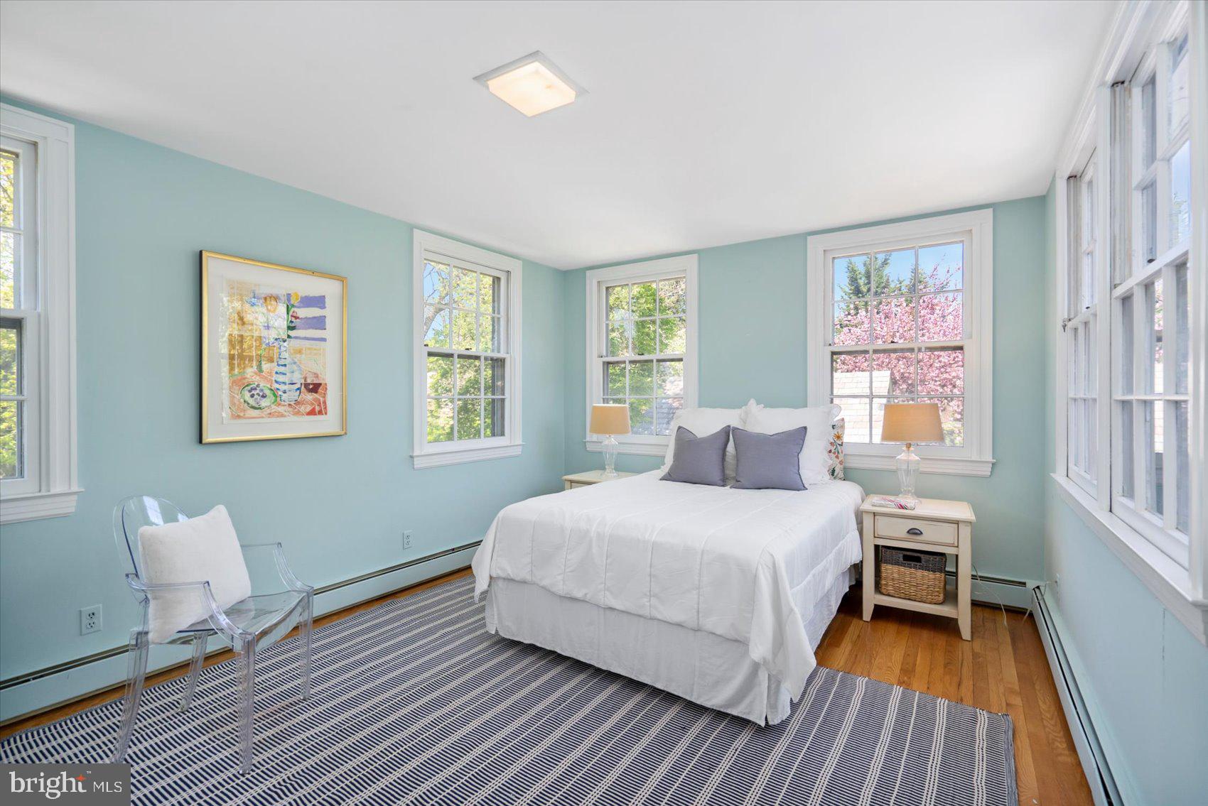 600 Somerset Road Baltimore, MD 21210 - Photo 37 of 59 a bedroom with a bed and wooden floor