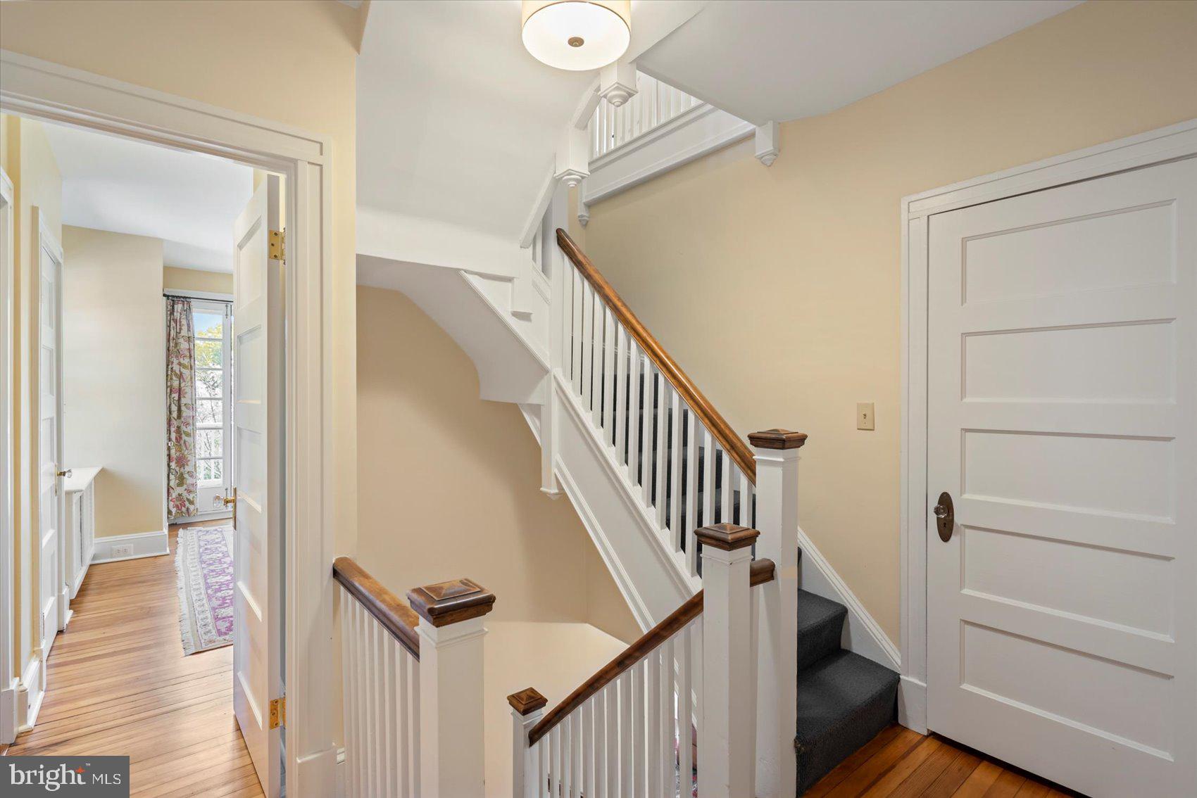 600 Somerset Road Baltimore, MD 21210 - Photo 41 of 59 a view of a hallway with wooden floor and staircase