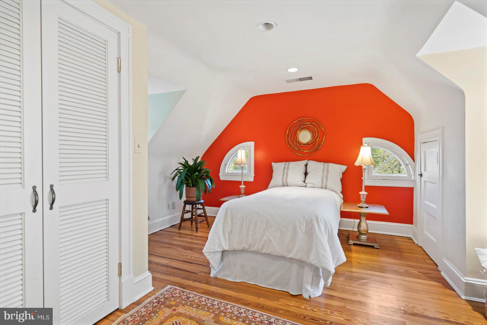 600 Somerset Road Baltimore, MD 21210 - Photo 44 of 59 a living room with a bed and a dresser with wooden floor