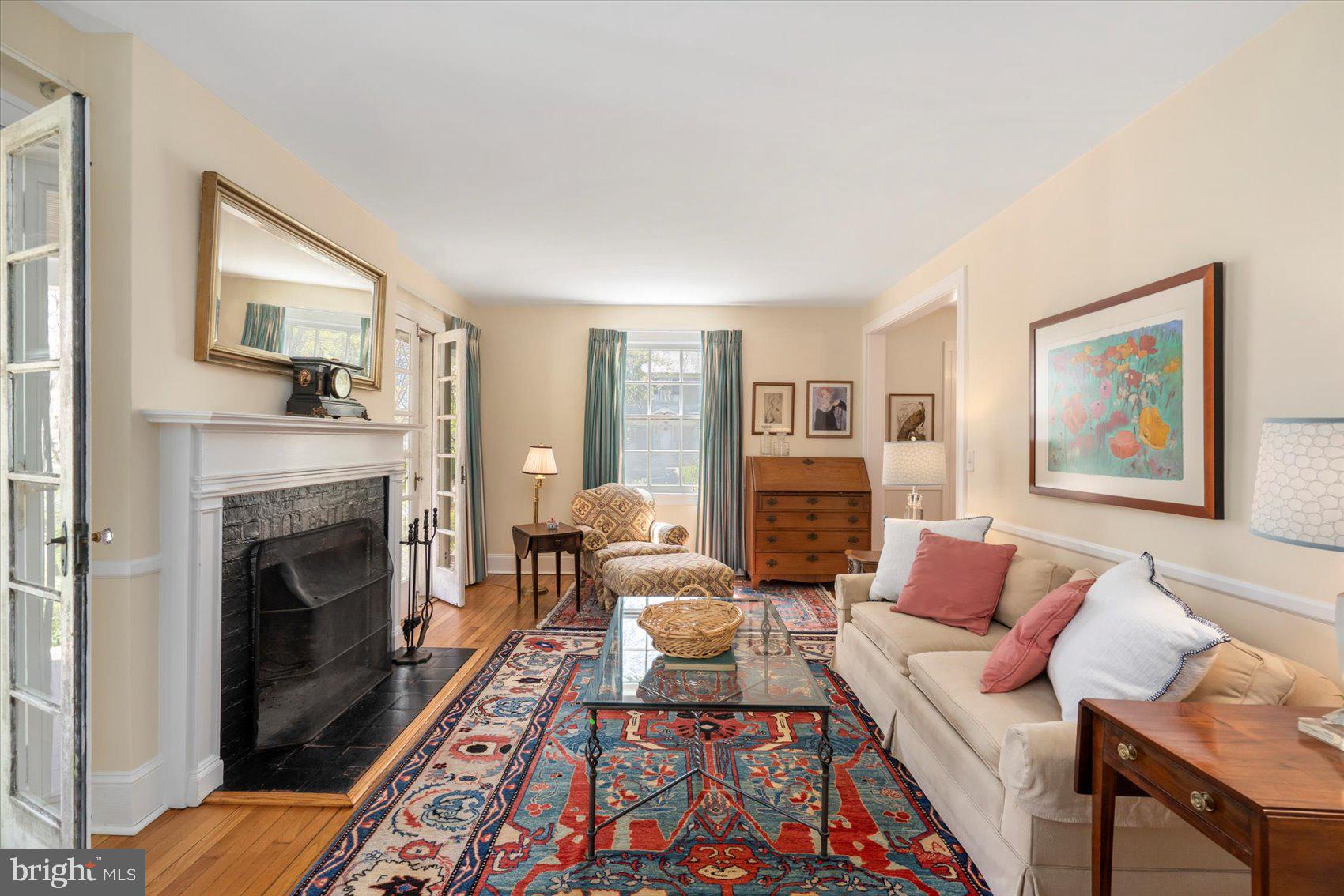 600 Somerset Road Baltimore, MD 21210 - Photo 7 of 59 a living room with furniture a fireplace and a painting