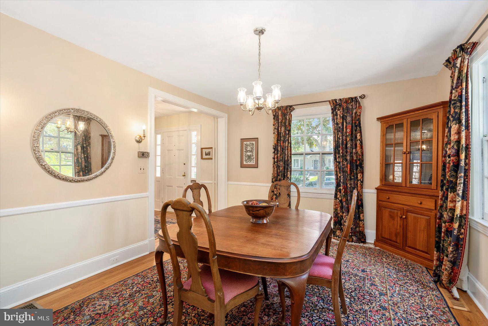 600 Somerset Road Baltimore, MD 21210 - Photo 8 of 59 a dining room with furniture a chandelier and wooden floor