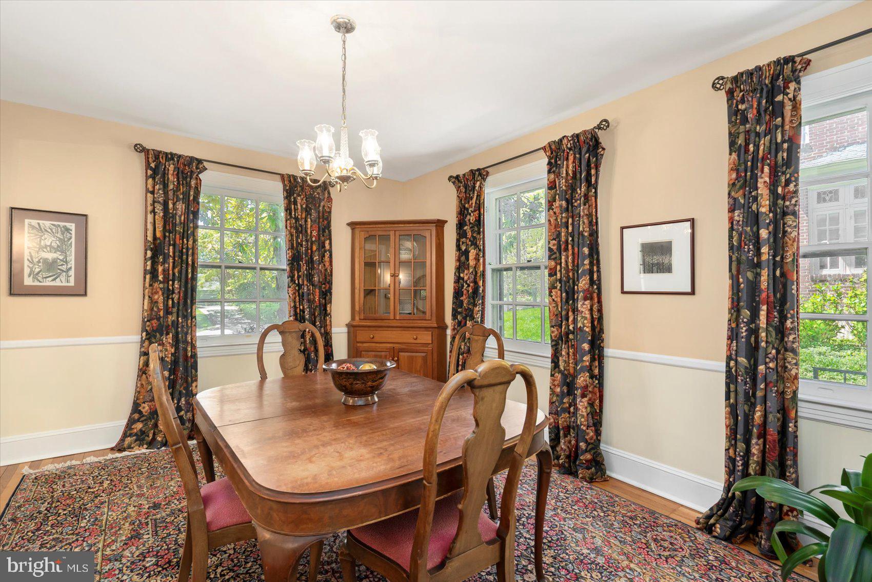 600 Somerset Road Baltimore, MD 21210 - Photo 10 of 59 a dining room with furniture a chandelier and window