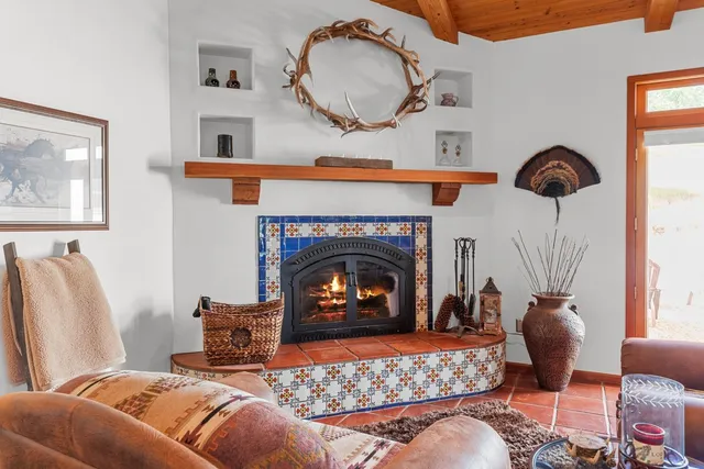 a bedroom with a bed and a fireplace