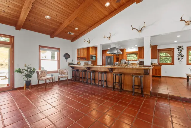 a kitchen with stainless steel appliances granite countertop a stove and a sink