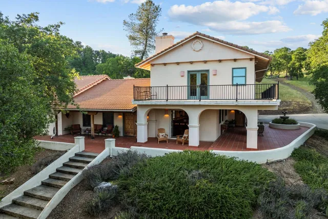 a view of two chairs in the balcony