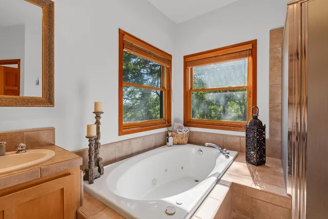 a view of a backyard with table and chairs