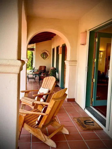 swimming pool view with a seating space