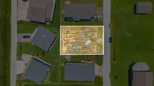an aerial view of residential house with pool and yard