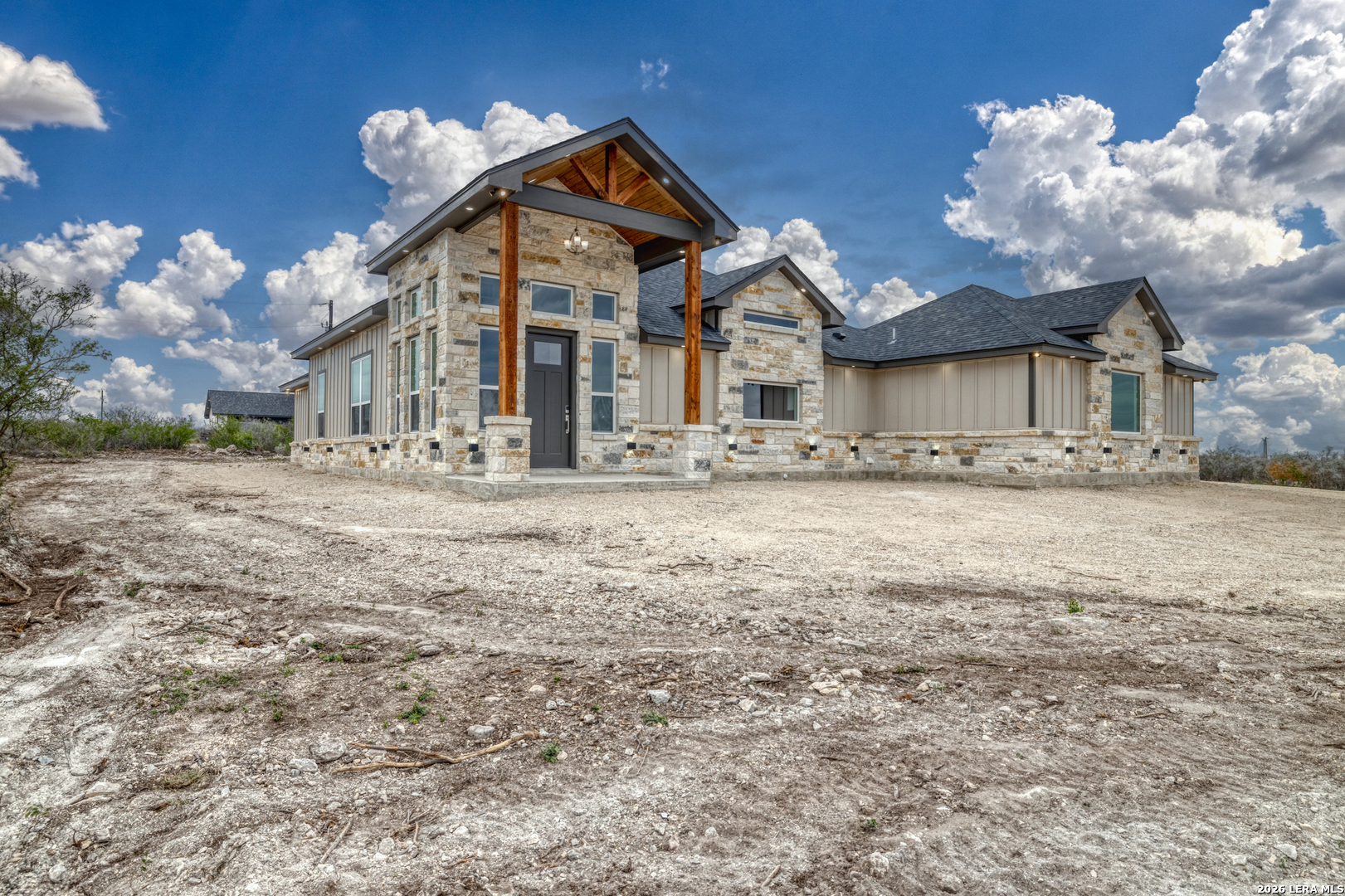22 Greystone Hills Uvalde, TX 78801 - Photo 16 of 68 a front view of a house with a yard