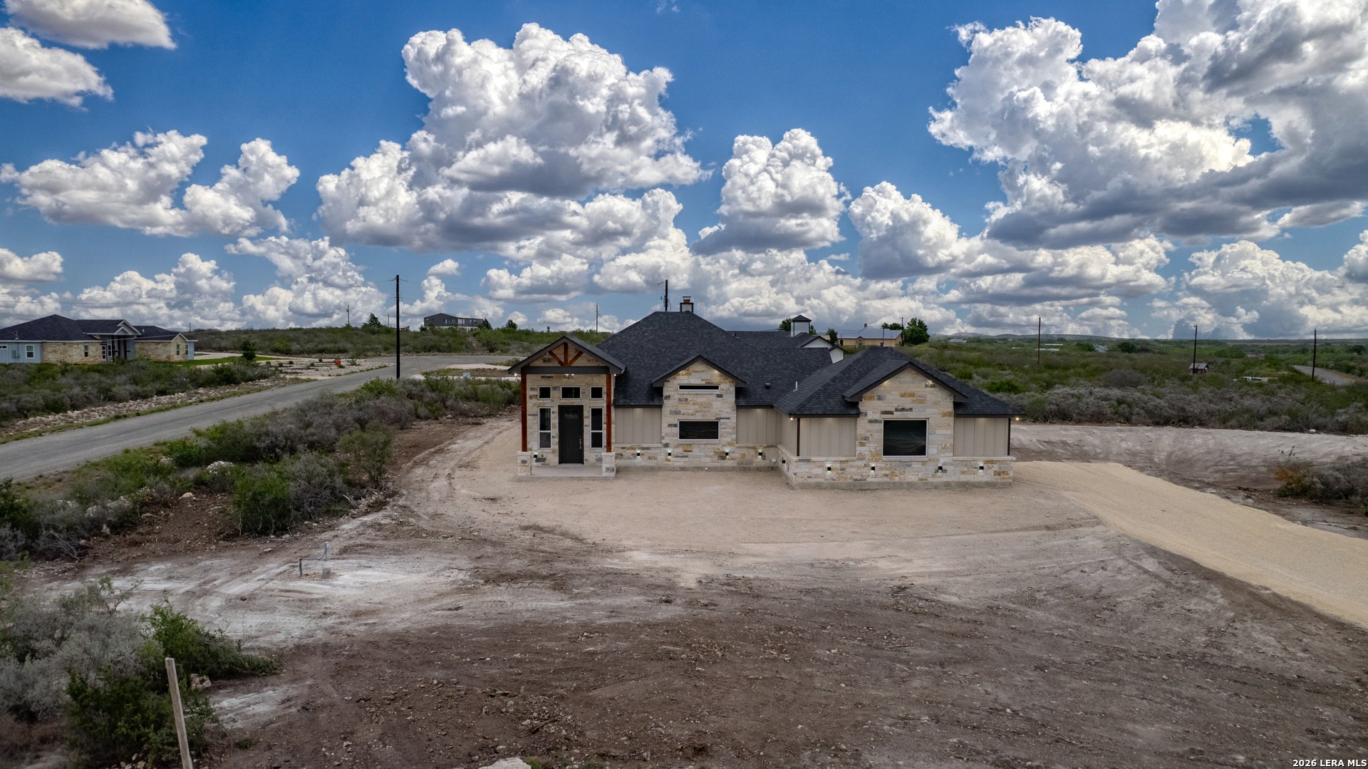 22 Greystone Hills Uvalde, TX 78801 - Photo 17 of 68 a front view of a house with a yard and garage