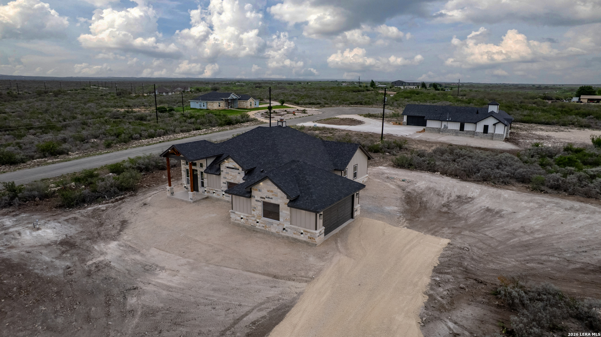 22 Greystone Hills Uvalde, TX 78801 - Photo 22 of 68 a view of a terrace with a garden and bench