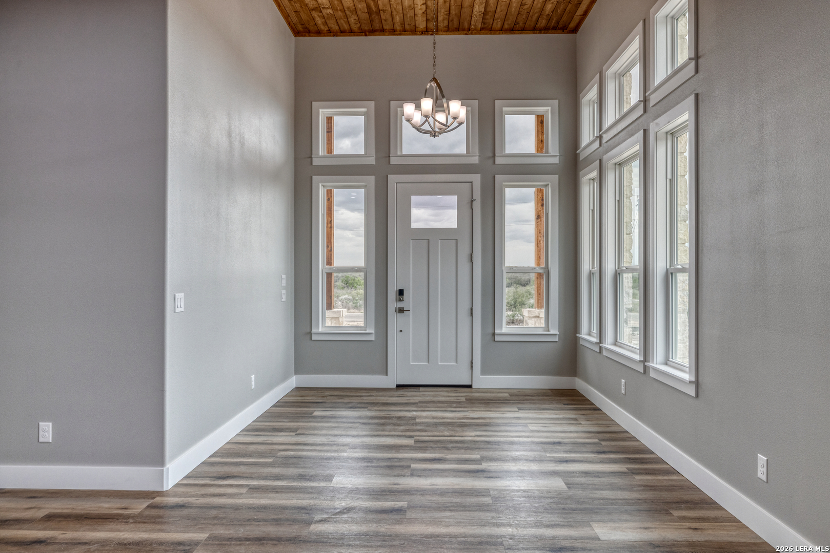 22 Greystone Hills Uvalde, TX 78801 - Photo 39 of 68 a view of an empty room with wooden floor and a window